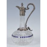 A circa 1880 cut glass claret jug, having silver plated mounts, the faceted neck above a squat