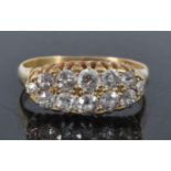 A late Victorian 18ct yellow gold diamond two-row half hoop eternity ring, featuring twelve
