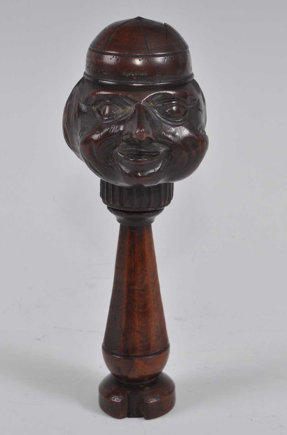 A 19th century treen figurative nutcracker, the head as a smiling man wearing a cap, the tapered - Bild 2 aus 5