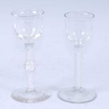 A circa 1765 wine glass, the ogee bowl above a double series opaque twist stem and standing upon a