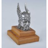 A Rover Viking head chrome car mascot, h.9cm, all raised on oak plinth