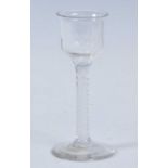 A circa 1765 wine glass, the lipped and basal fluted ogee bowl above a double series opaque twist