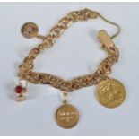 An 18ct gold flat double curblink bracelet containing a small number of charms, principally being