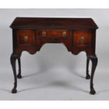 An Edwardian lowboy, being recently re-veneered in figured walnut with cross and feather banding,