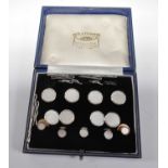 A 9ct white gold button, cufflink and dress stud set, the four 14mm diameter buttons with