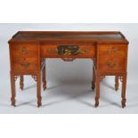 A circa 1900 Japanese influenced satinwood inverted breakfront kneehole writing desk, having gilt