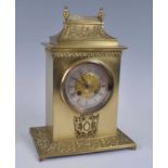 A late 19th century gilt brass cased mantel clock, having an unsigned silvered chapter ring with