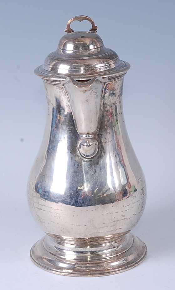 An early George III silver wine or beer jug, having a hinged domed cover, S-scroll handle, and - Image 2 of 6