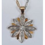 A yellow and white metal diamond flower cluster pendant, comprising 17 Old European cut diamonds