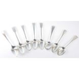 A harlequin set of eight 19th century silver tablespoons, mainly in the Old English pattern, some