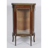 A French Napoleon III mahogany and gilt metal mounted vitrine, having glazed top, concave glass door
