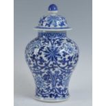 A Chinese late Qing dynasty blue and white porcelain temple jar and cover, of baluster form, in