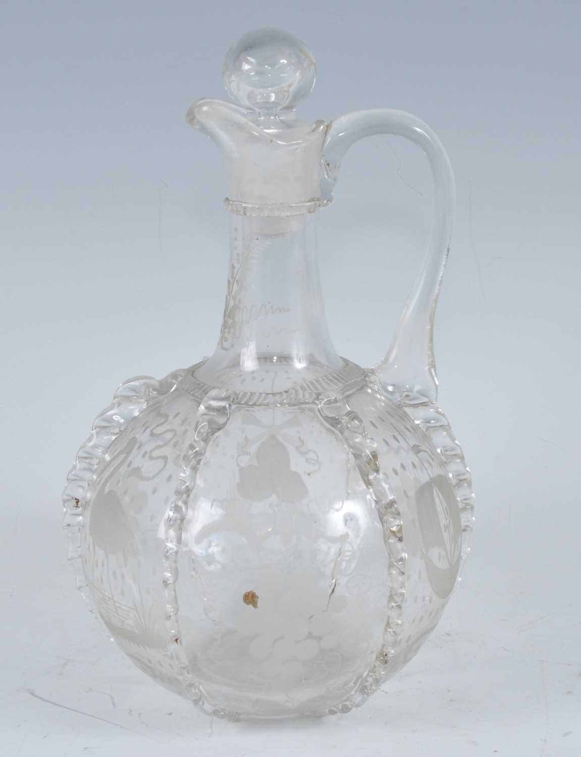 A circa 1790 Dutch glass carafe, the cylindrical neck with single loop handle, the lobed globular