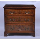 A walnut and burr walnut chest, in the early 18th century style, the four-quarter veneered top