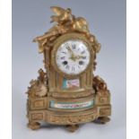 J H Silvani of Paris - a mid-19th century French gilt bronze and porcelain inset mantel clock, the