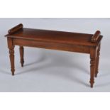 A Victorian style oak window seat, having turned ends and on ring turned tapering supports, w.