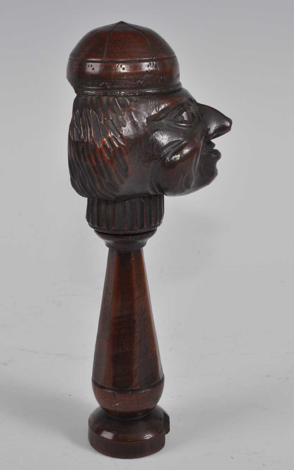 A 19th century treen figurative nutcracker, the head as a smiling man wearing a cap, the tapered - Bild 5 aus 5