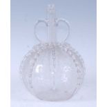 A circa 1790 Dutch glass carafe, the cylindrical neck flanked by twin loop handles, the lobed