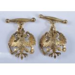 A pair of yellow metal Russian Imperial double-headed eagle cufflinks, each featuring an engraved