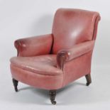 James Shoolbred of London - a late Victorian walnut framed and red leather upholstered armchair,