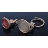 An early 19th century yellow metal fob seal, the carnelian intaglio carved with a profile