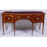 A 19th century mahogany and satinwood crossbanded serpentine front sideboard, having a centre drawer