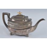 A George III silver teapot, of shaped rectangular form with engraved banded decoration, walnut