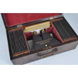 A cased circa 1850s Brewster type stereoscopic viewer by the London Stereoscopic Company, together