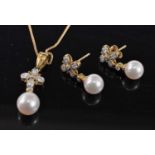 An 18ct yellow gold, pearl and diamond pendant and earring set, the pendant comprising an 8mm