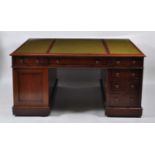 A Victorian mahogany twin pedestal partner's desk, having a triple inset gilt tooled leather writing