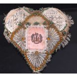 A WW I sweetheart beadwork pin cushion of heart shape, the central pannel printed with the Essex