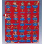 A collection of assorted cap badges to include Royal Army Service Corps, East Surrey Regiment,