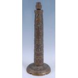 A WW II trench art type lamp base, of brass construction, the slightly tapering column embossed with