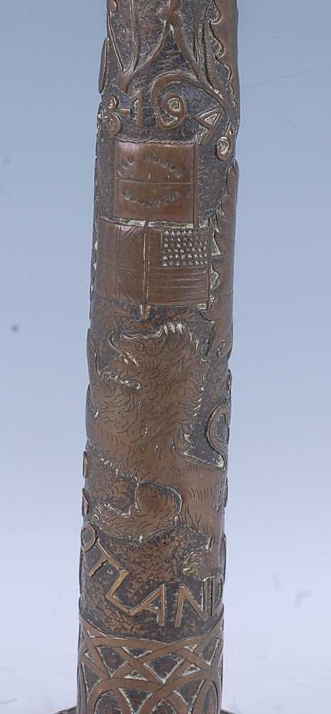 A WW II trench art type lamp base, of brass construction, the slightly tapering column embossed with - Image 3 of 5