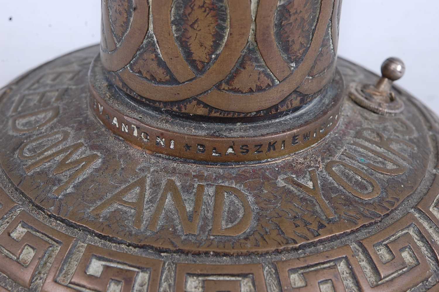 A WW II trench art type lamp base, of brass construction, the slightly tapering column embossed with - Image 4 of 5