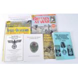 A collection of military related literature to include German Army Badges of World War II, The