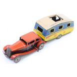 Mettoy tinplate clockwork saloon car with caravan comprising, 2 seater car finished in red and black