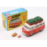 Corgi Toys No. 508 Commer Holiday Camp bus comprising of an orange and white body with two suitcases