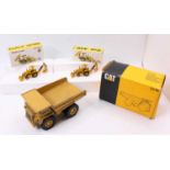 NZG and Conrad 1/50th scale boxed group of 3 comprising 2x NZG No. 285 Caterpillar 416 Backhoe