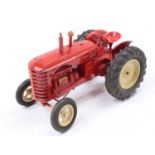 A Moko Lesney No. 745D Massey Harris tractor, comprising of red body with cream hubs, complete