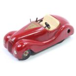 Jibby (Switzerland) tinplate clockwork Schuco style Radio Car, red with cream seats, trademark to