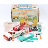 A Deluxe Topper Toys Ltd boxed service station gift set comprising of tow truck, open top car,