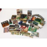 3 boxes containing a large quantity of Scalextric accessories including buildings, track edging,