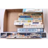 One box containing a mixed selection of warship and ocean liner kits from makers such as Airfix,