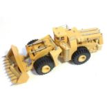 A resin and white metal part complete model of a Caterpillar four-wheel wheel loader, kit is