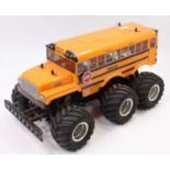 A Tamiya radio-controlled model of a G6-01 chassis 6-wheel Monster Truck style school bus, a well