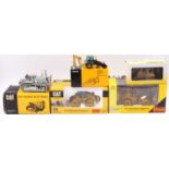 Five various boxed Caterpillar and Liebherr diecast construction vehicles and accessories, to