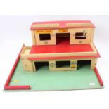 Two wooden commercially built garage and filling station playsets, mainly constructed from wood