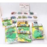 A collection of Britains plastic tree models to include Oak Tree and Silver Birch, together with a