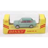 Dinky Toys No.138 Hillman Imp, metallic green body with red interior, and suitcase, housed in the